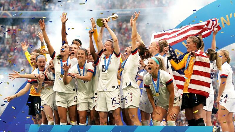 USA’s Megan Rapinoe and team-mates celebrate with the trophy at the Stade de Lyon. Photograph: PA Wire