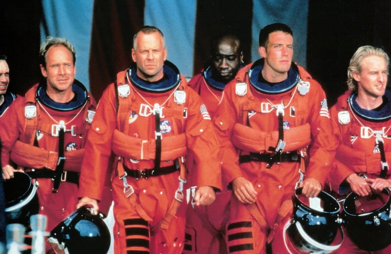 Steve Buscemi, Will Patton, Bruce Willis, Michael Clarke Duncan, Ben Affleck, and Owen Wilson  in NASA uniforms in a scene from the film Armageddon, 1998. File photograph: Touchstone/Getty Images