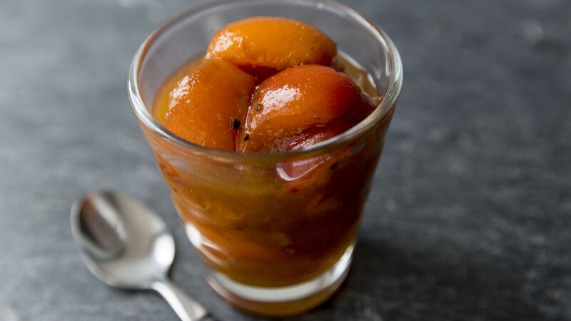 Poached apricots and cardamon Photograph: Emma Jervis