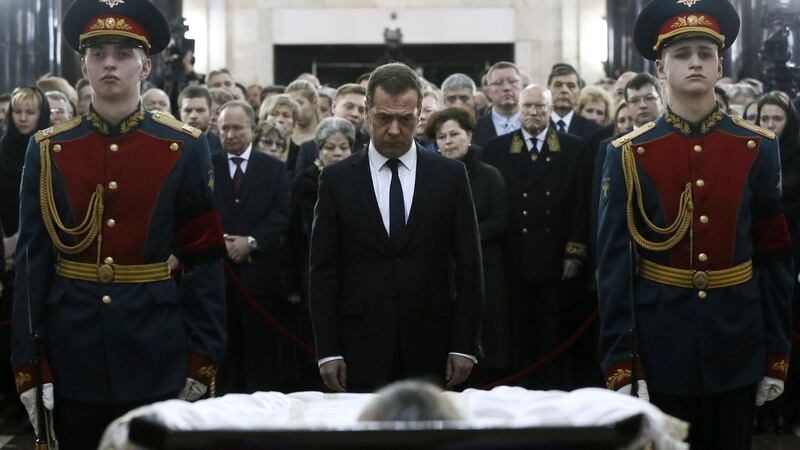 Russian prime minister Dmitry Medvedev pays his respects to murdered Andrei Karlov. Photograph: Ekaterina Shtukina/AFP/Getty Images