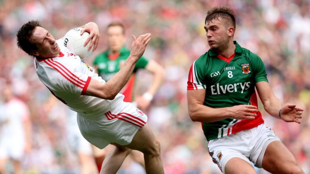 Mayo’s Aidan O’Shea tackles Colm Cavanagh of Tyrone during the All-Ireland football semi-final, a foul which resulted in a yellow card. Photograph: James Crombie/Inpho