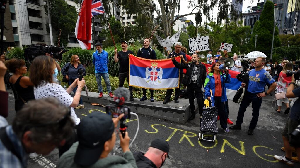 Supporters outside the Park Hotel quarantine facility where tennis star Novak Djokovic is being detained in Melbourne. Photograph: Joel Carrett/EPA