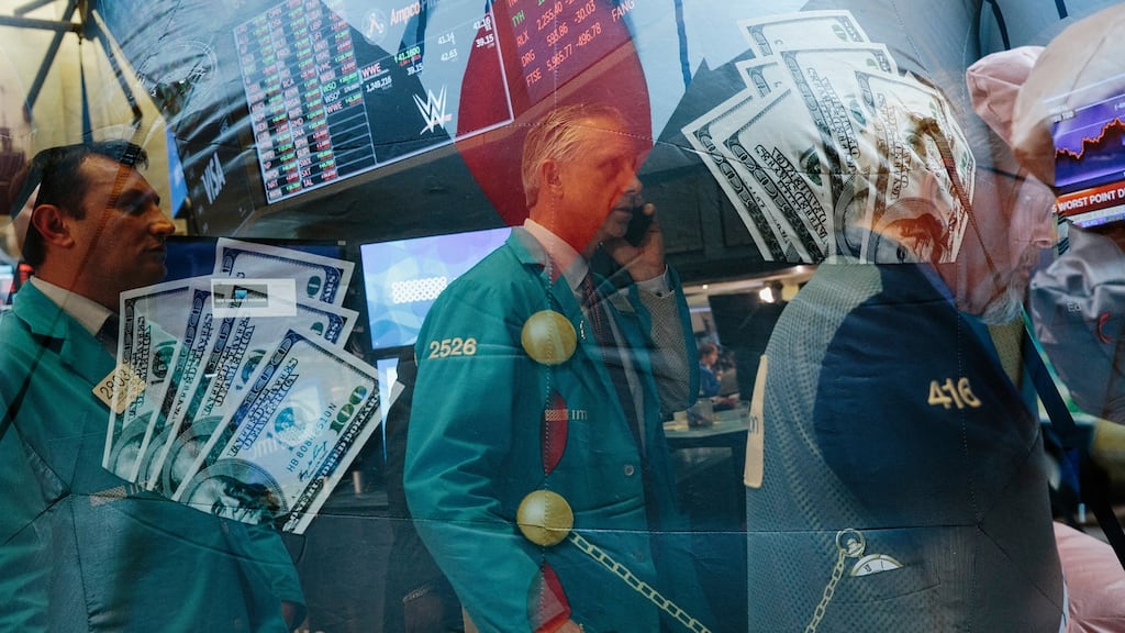 An in-camera double exposure of money and traders on the floor of the New York Stock Exchang. Photograph: Mark Abramson/The New York Times