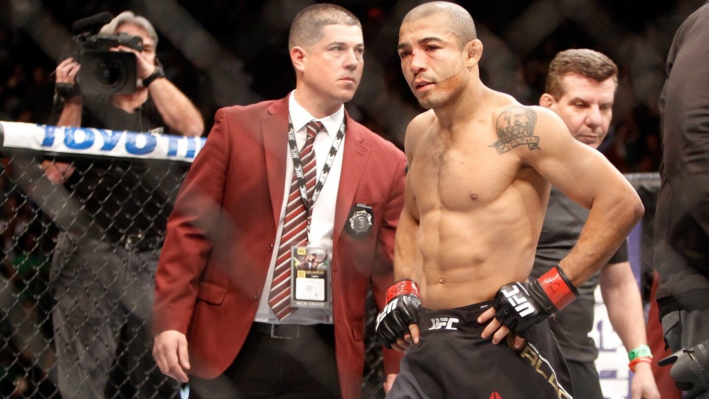 Jose Aldo walks away after losing to Conor McGregor in their featherweight title fight. Photograph: Getty