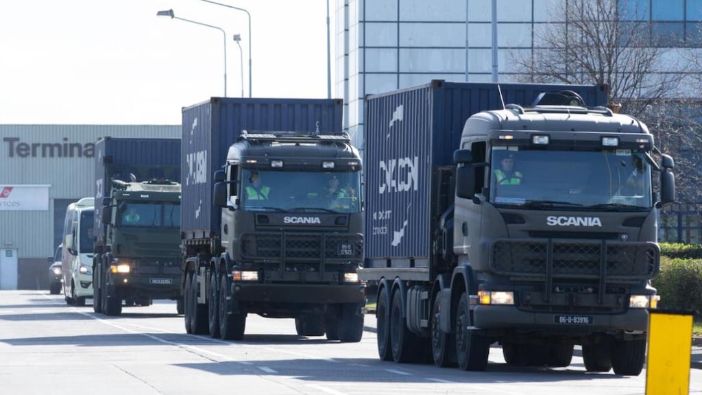 Defence Forces vehicles transport personal protective equipment from  Dublin Airport after its arrival from China. Photograph: Tom Honan