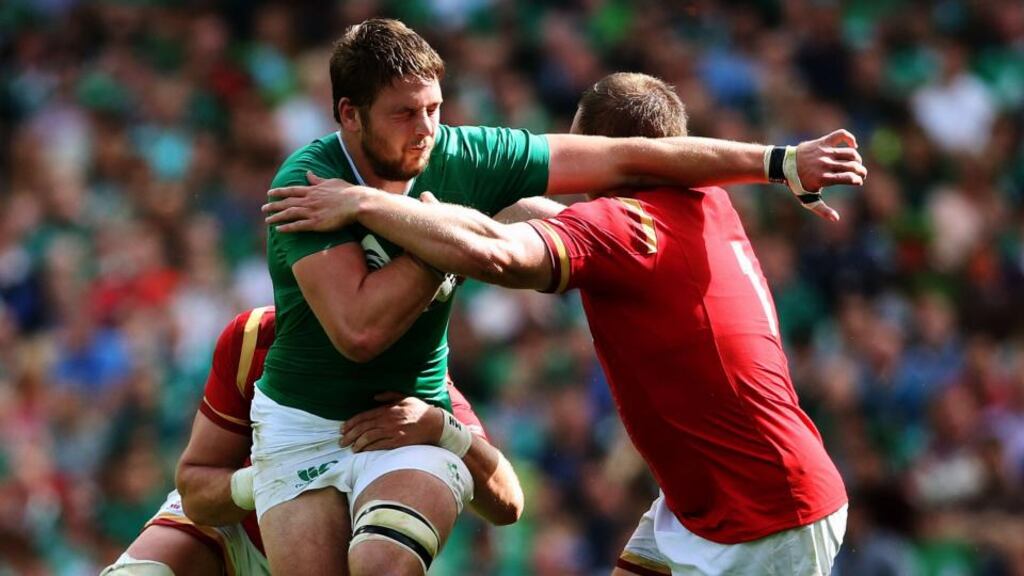 Ireland’s Iain Henderson is tackled by Wales’ Gethin Jenkins and captain Alun Wyn Jones during the World Cup Warm Up Match at the Aviva Stadium, Dublin. Photo: Brian Lawless/PA