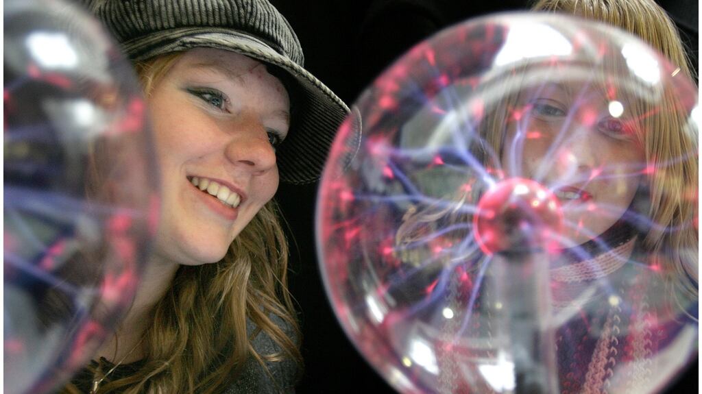 Rebecca Kelly, left, and Breda Kenny, both from Castlecomer Community School, Co Kilkenny, at the Trinity College Open Day with a Lightening Ball which contains a mixture of gases that generate electromagnetic waves