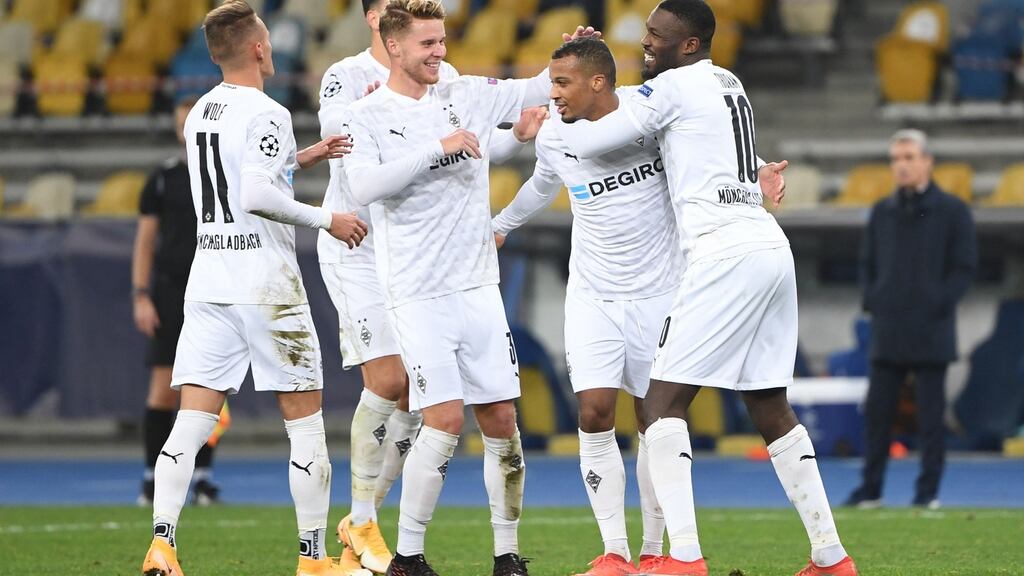 Borussia Mönchengladbach’s Alassane Plea (second from right) celebrates after completing his hat-trick in the  Champions League Group B match against Shakhtar Donetsk at the Olympiyskiy Stadium in Kiev. Photograph: Sergei Supinsky/AFP via Getty Images