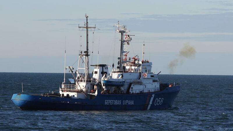 A Russian coast guard vessel fires a warning shot as Greenpeace International activists protest near a Gazprom oil platform in the Pechora Sea. Photograph: Denis Sinyakov/Greenpeace handout