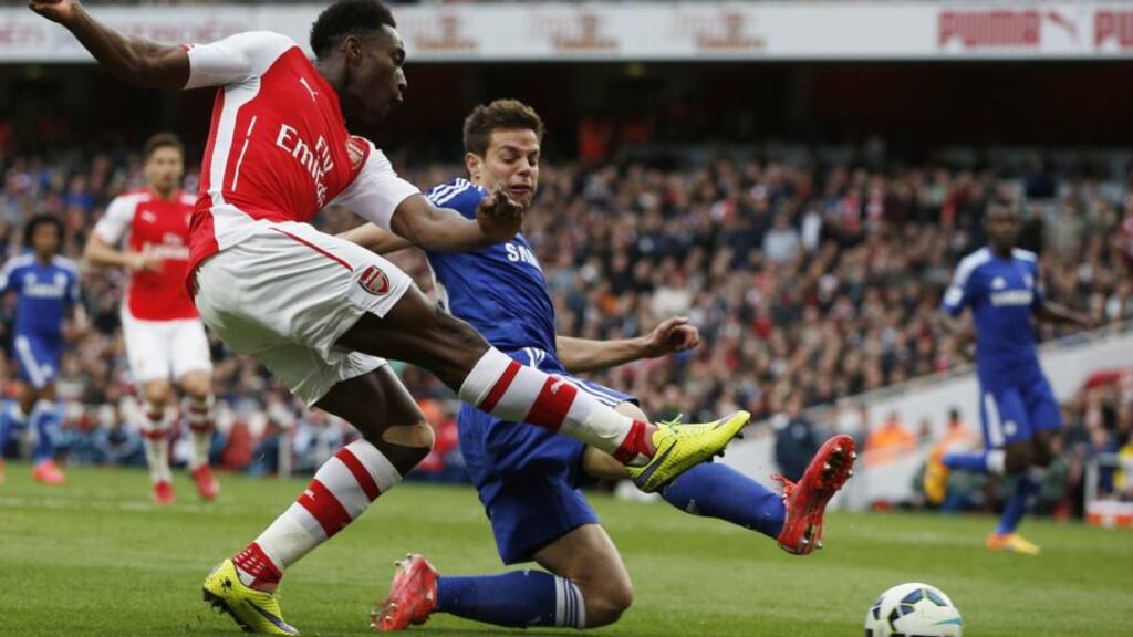Chelsea left back Cesar Azpilicueta tries to block Danny Welbeck’s cross during the Premier League game at Arsenal . Photo: Adrian Dennis/AFP