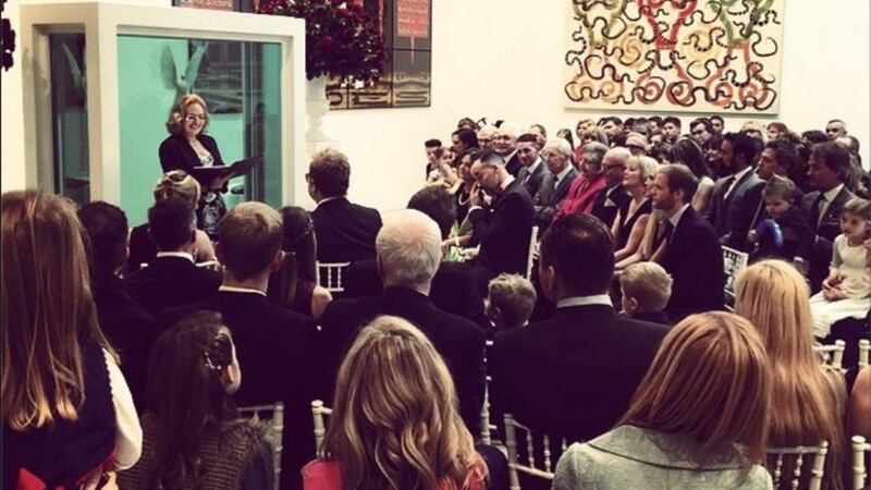 A registrar welcomes Elton John and David Furishes guests to their wedding ceremony. Photograph: Elton John/Instgram.