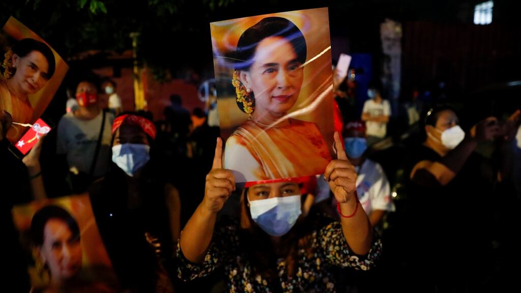 Supporters of the National League for Democracy (NLD) party, led by Myanmar state counsellor Aung San Suu Kyi, celebrate in Yangon, Myanmar, on Sunday. Photograph:  Lynn Bo Bo/Epa
