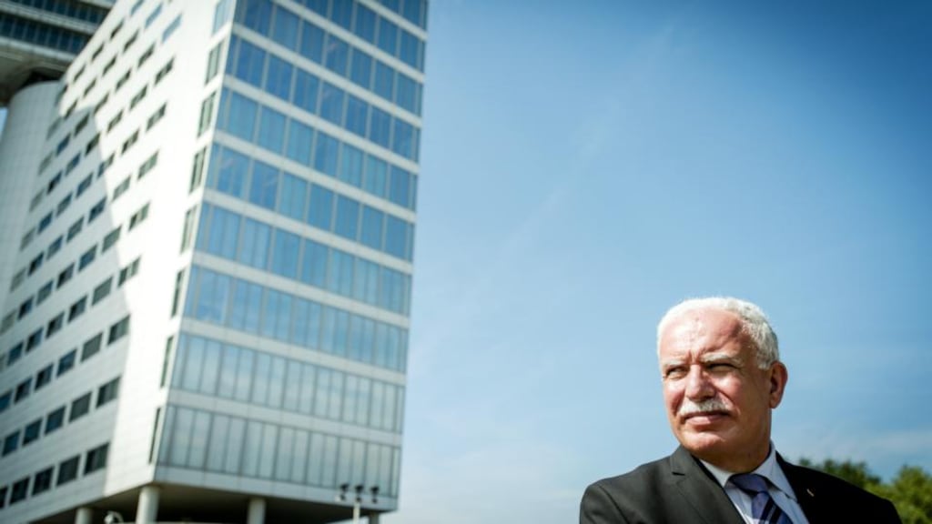 Palestinian Authority foreign minister Riyad al-Maliki leaves the International Criminal Court in The Hague, having submitted files on alleged Israeli war crimes in Gaza, continuing Israeli settlement expansion and alleged maltreatment of Palestinian prisones. Photograph: Robin Van Lonkhuijsen/ AFP/Getty Images