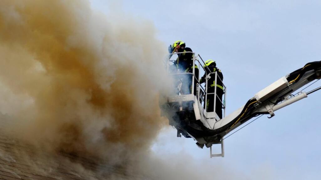 Firefighters wreathed in smoke in Bray this evening. Photograph: Aidan Crawley/The Irish Times