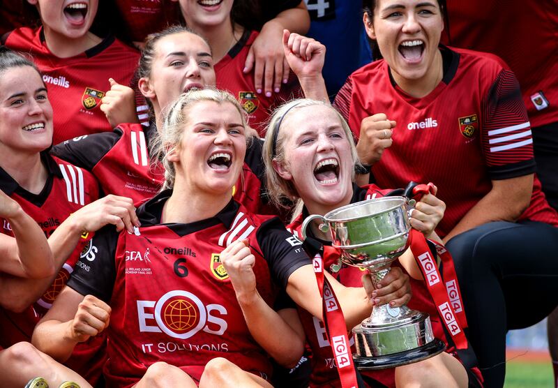 Down players celebrate with the cup after the game. Photograph: Leah Scholes/Inpho