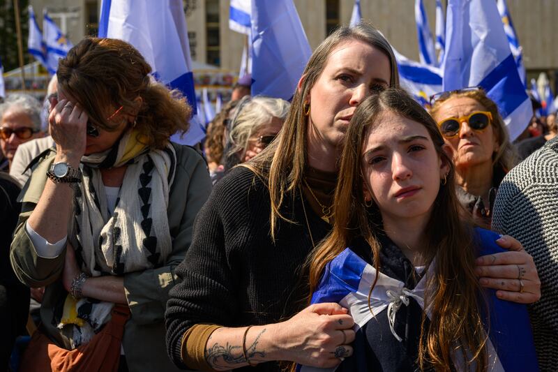 Crowds at Hostage Square in Tel Aviv watch a live feed from the funeral of Shiri Bibas and her two sons. Photograph: Alexi J Rosenfeld/Getty Images
