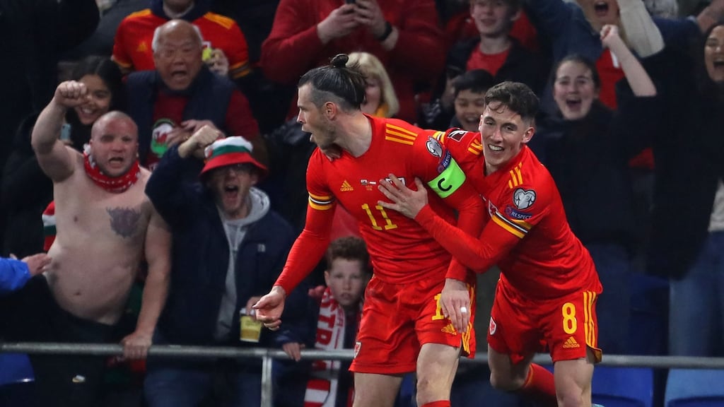 Wales’ midfielder Gareth Bale celebrates with Harry Wilson after scoring their second goal against Austria in Cardiff. Photograph: Geoff Caddick/AFP via Getty Images