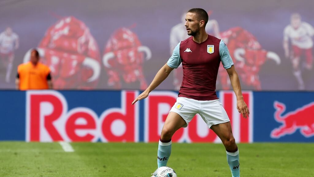 Conor Hourihane of Aston Villa runs with the ball during the pre-season friendly match between RB Leipzig and Aston Villa. Photograph: Matthias Kern/Getty Images