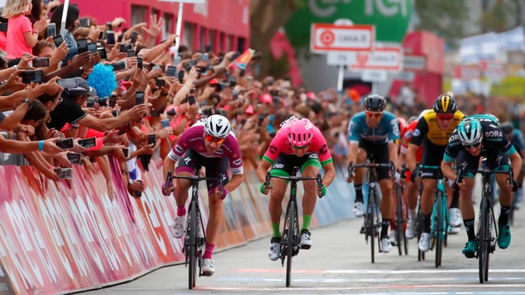 Elia Viviana (L) crosses the finish line in stage three of the Giro D’Italia. Photograph: Luk Benies/AFP