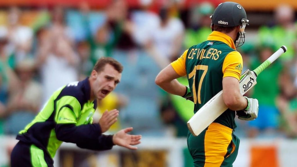 Ireland’s Andy McBrine  celebrates after he dismissed South Africa’s captain AB de Villiers for 24 runs during the  World Cup match at Manuka Oval in Canberra. Photo: Jason Reed/Reuters