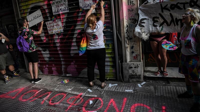 Posters stating “We won’t be silent” are placed at the Athens shop where Zak Kostopoulos died on September 21st, 2018. Photograph: Aris Messinis