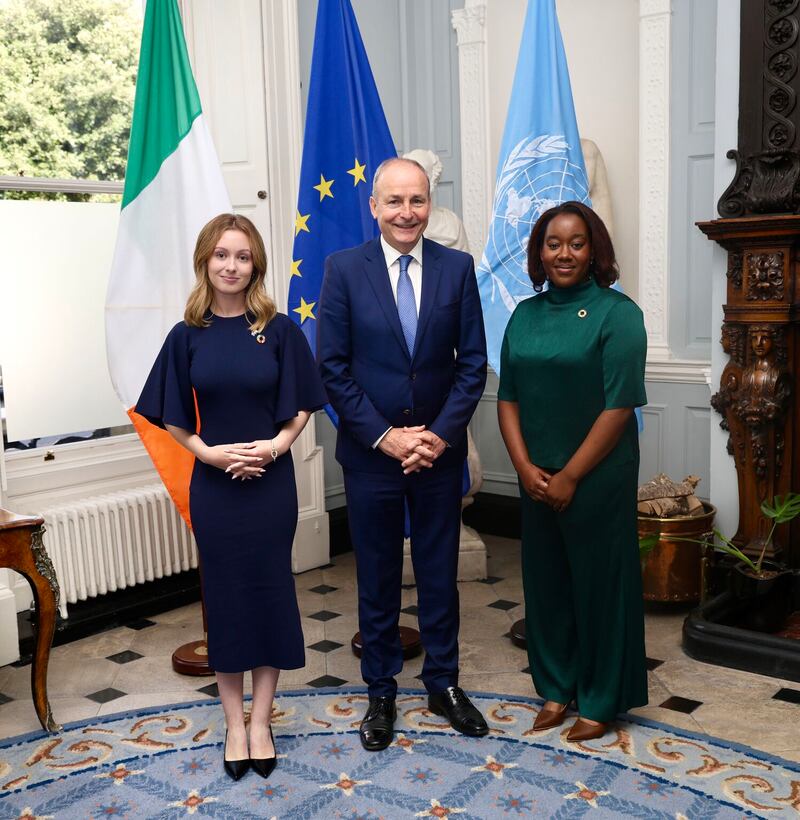 Lauren Jones Brennan and Natasha Maimba with Minister for Foreign Affairs Micheál Martin
