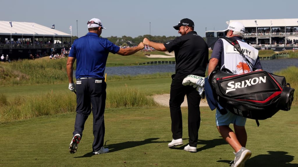Shane Lowry and Pádraig Harrington bump fists during their final round at Kiawah Island. Photograph: Jamie Squire/Getty