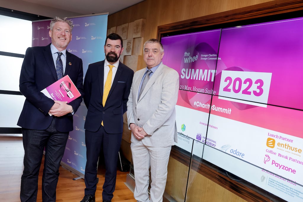 Ivan Cooper, CEO of The Wheel, Joe O'Brien, Minister of State with responsibility for Community Development and Charities, and Vincent Keenan, chair of The Wheel, at The Wheel's National Charity Summit, Ireland’s largest gathering of charities and community groups. Photograph: Maxwell Photography, Dublin
