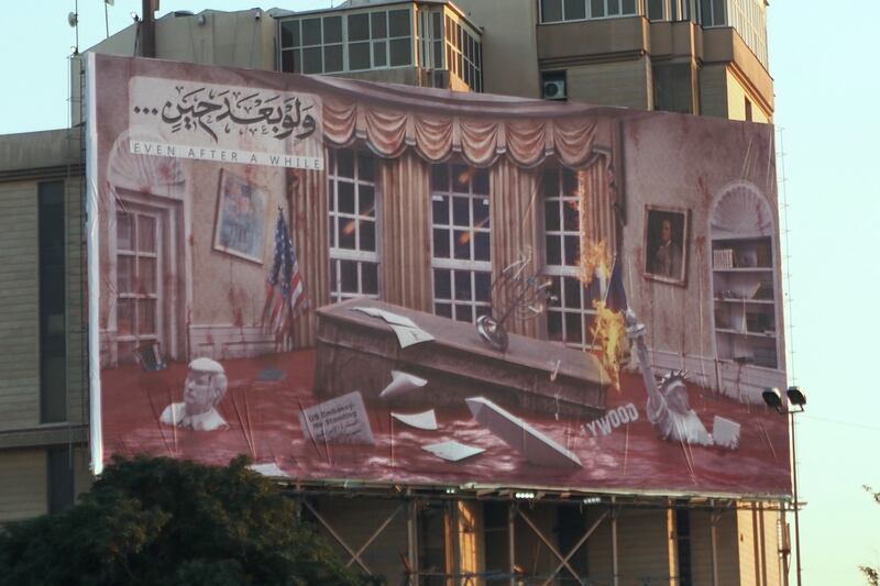 A billboard erected on Baghdad's Firdos Square by Hashd al-Shaabi, Iran-backed Shia militias. It shows the Oval Office bathed in blood and a sinking bust of former US president Donald Trump. Photograph: Lorraine Mallinder