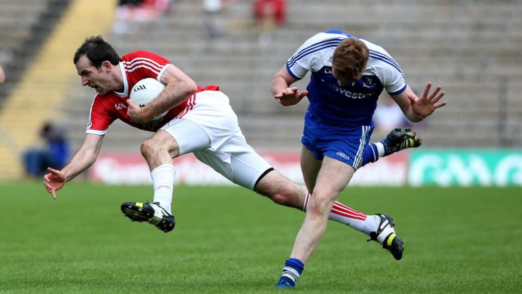 Tyrone’s Justin McMahon claims possession ahead of Monaghan’s Kieran Hughes during the Ulster SFC quarter-final clash in Clones. Photograph: Donall Farmer/Inpho