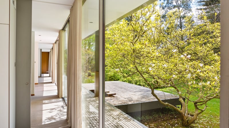 View along south wall to terrace and entrance.