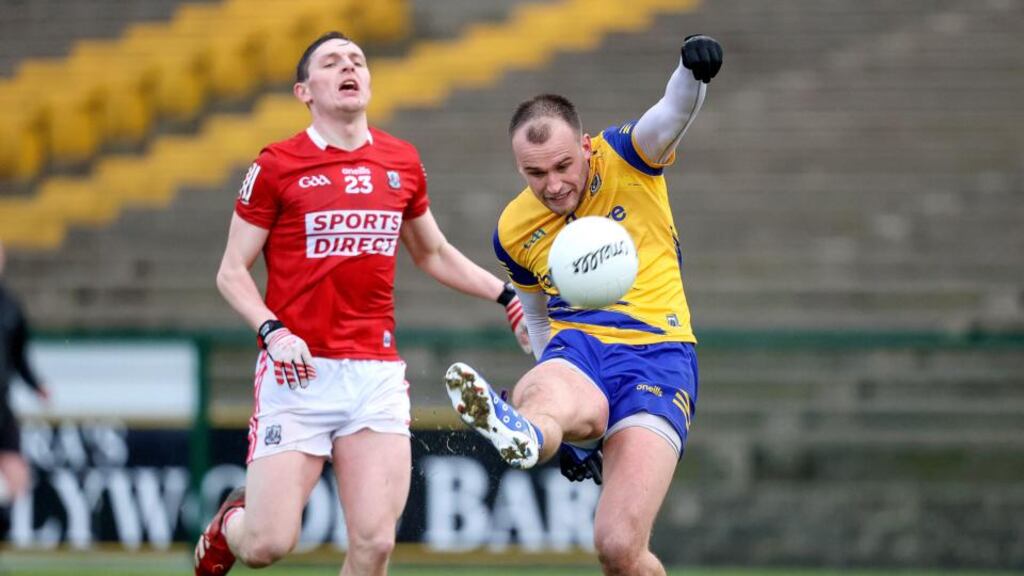 Roscommon’s Enda Smith in action against Cork’s Eoghan McSweeney during the Allianz Football League Division 2 match at  Dr Hyde Park. Photograph: Bryan Keane/Inpho