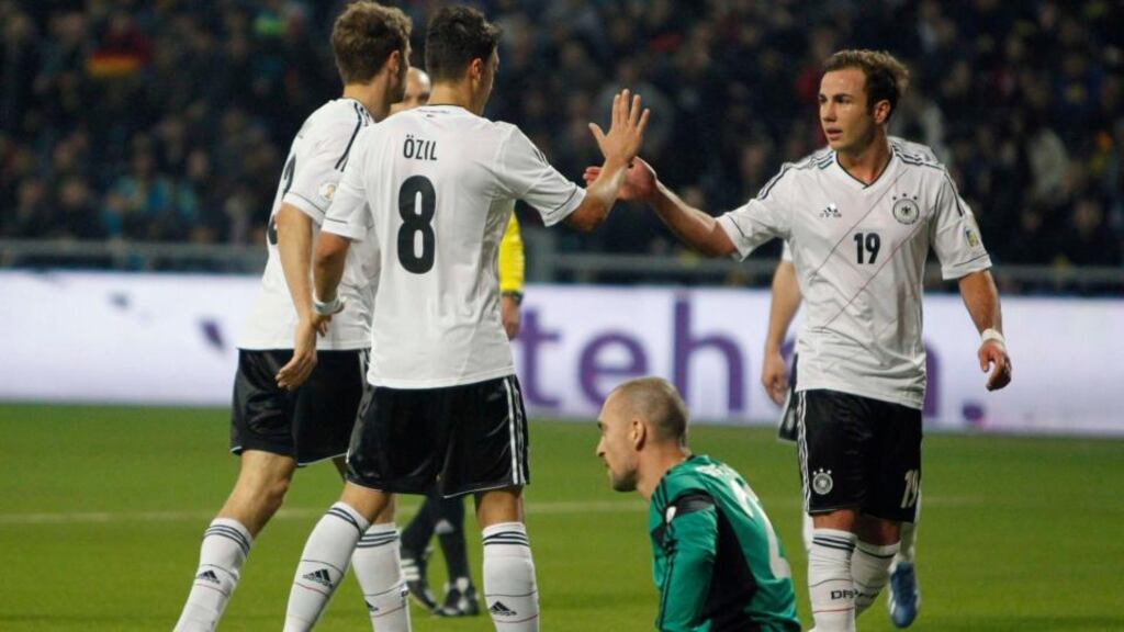 Germany's players celebrate next to the dejected Kazakhstan goalkeeper Andrei Sidelnikov. Photograph: Shamil Zhumatov/Reuters