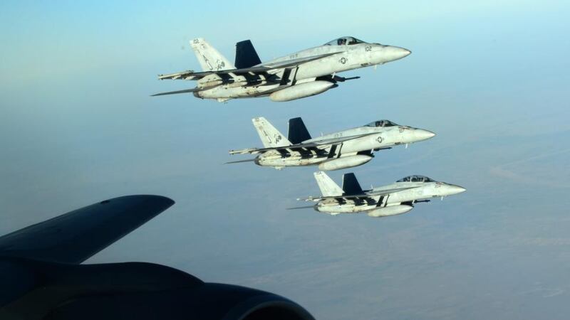 A formation of US navy F-18E Super Hornets leaving after receiving fuel from a KC-135 Stratotanker over northern Iraq, on September 23rd. EPA/DOD/US AIR FORCE/Sgt Shawn Nickel