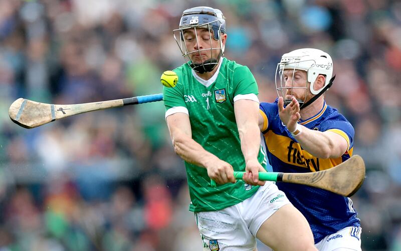 Limerick’s David Reidy and Michael Breen of Tipperary. Photograph: James Crombie/Inpho