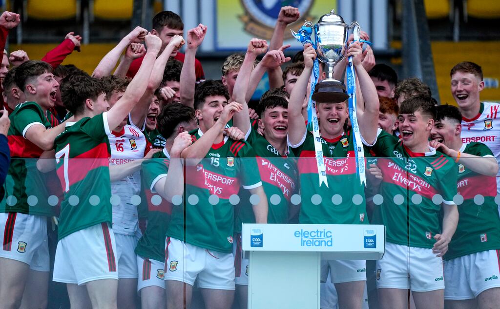The Mayo team lift the trophy. Photograph: James Lawlor/Inpho