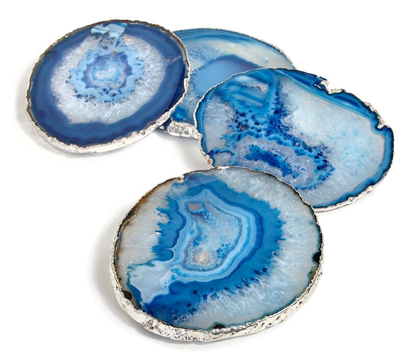 A set of blue RabLabs coasters edged in pure silver (€150)