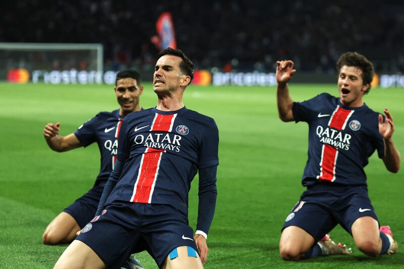 Fabian Ruiz celebrates with Achraf Hakimi and Joao Pedro Goncalves Neves after scoring the opening goal. Photograph: Thomas Samson/AFP via Getty Images