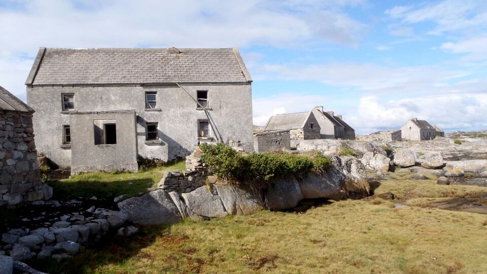 The deserted five-house village on Inisherk. The house facing the camera is the one which is preserved. The others all look to sea and are very weather damaged. Photograph: Gary Quinn