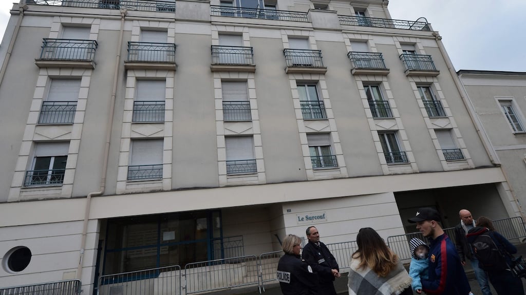 Police and residents stand in front of a building in which four people were killed and several others injured after a balcony collapsed, on Saturday night in Angers, western France. Photograph: Jean-Francois Monier/AFP/Getty Images