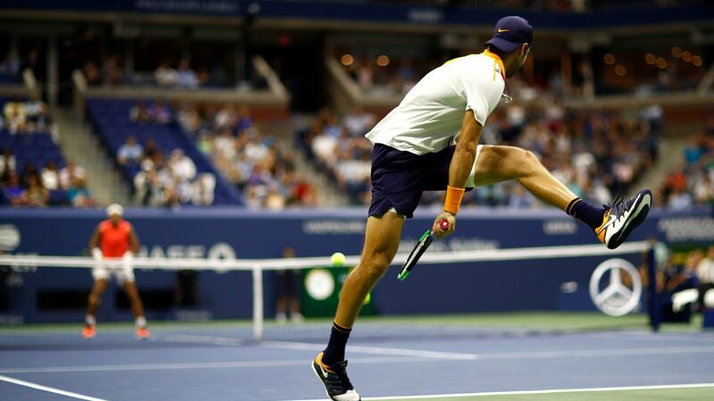 Karen Khachanov plays a shot during his epic defeat to Rafael Nadal in New York. Photograph: Julian Finney/Getty