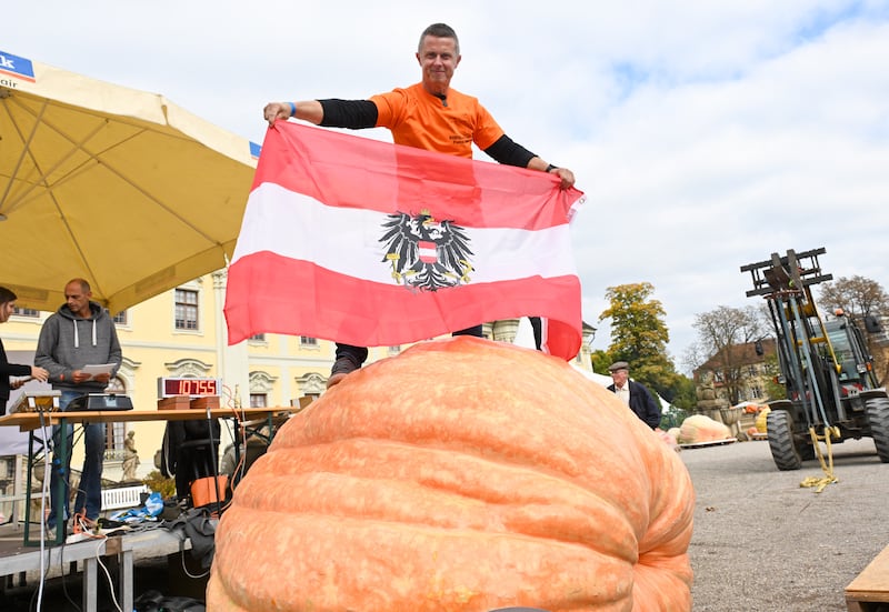Wolfgang Nittnaus from Austria with his giant pumpkin after winning the European Pumpkin Weighing Championships in the garden of Ludwigsburg Castle in Ludwigsburg, southern Germany, on October 12th. Photograph: Thomas Kienzle/AFP via Getty