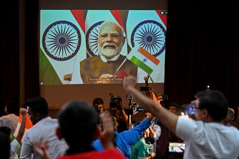 India's prime minister Narendra Modi congratulates the Indian Space Research Organisation for the successful landing of the Chandrayaan-3 spacecraft on the south pole of the moon, during a live stream of the event at the Nehru Science Centre in Mumbai. Photograph: Punit Paranjpe/AFP via Getty Images