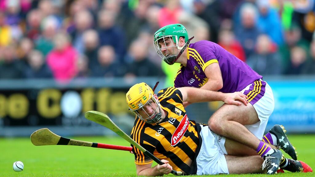 Kilkenny’s Colin Fennelly with Shaun Murphy of Wexford. Murphy provides the cover as his fellow defenders augment the team’s attack. Photograph: James Crombie/Inpho
