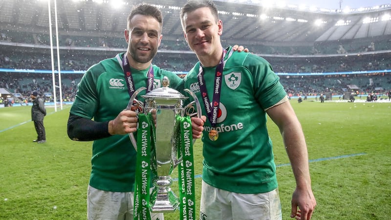 Conor Murray and Johnny Sexton celebrate with the Six Nations Championship trophy after victory over England at Twickenham last year. Photograph: Dan Sheirdan/INpho