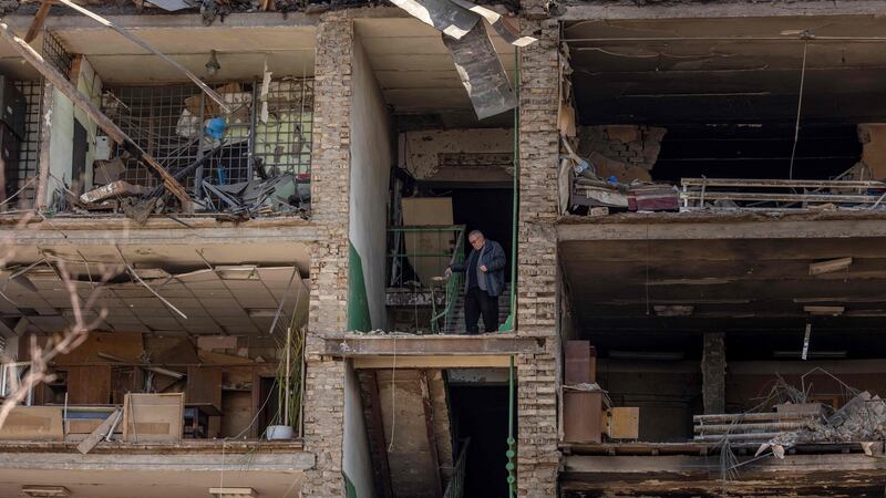 A man stands in a building with a collapsed facade at the Vizar company military-industrial complex, after the site was hit by overnight Russian strikes, in the town of Vyshneve, southwestern suburbs of Kyiv. Photograph: Fadel Senna/AFP via Getty