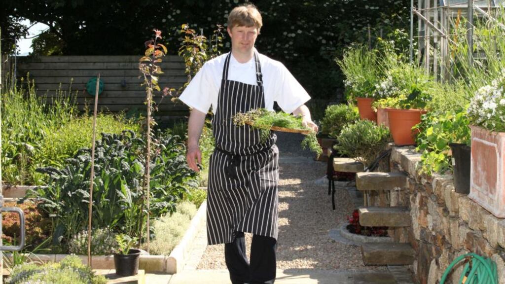 Graham Neville, head chef at Restaurant FortyOne, collecting produce from the kitchen garden in Killiney