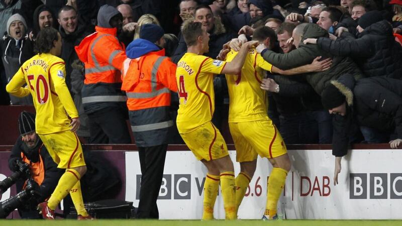 Liverpool striker Rickie Lambert (right) celebrates with fans after scoring their second goal at Villa Park. Photograph: Ian Kington/AFP/Getty Images