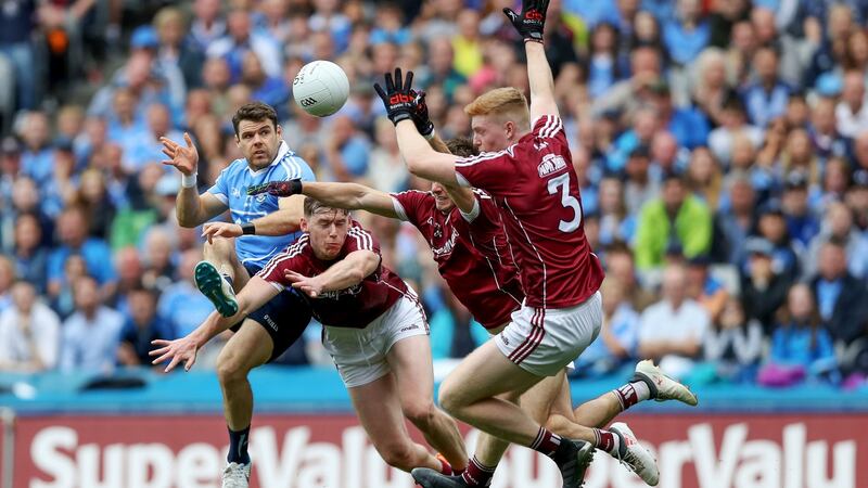 Dublin’s Kevin McManamon is blocked by the Galway trio of Thomas Flynn, Eoghan Kerin and Seán Andy Ó Ceallaigh. Photograph: Tommy Dickson/Inpho