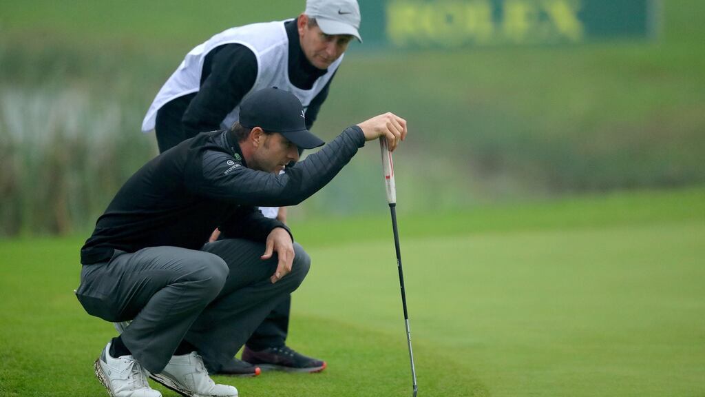 Laurie Canter lines up his putt on the 18th green during the second round of the Italian Open at Chervo Golf Club in Brescia. Photograph: Warren Little/Getty Images